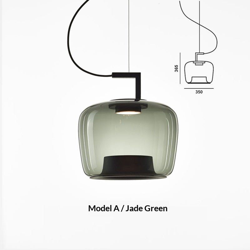 Art glass pendant lamp on an off-white studio background, full profile view