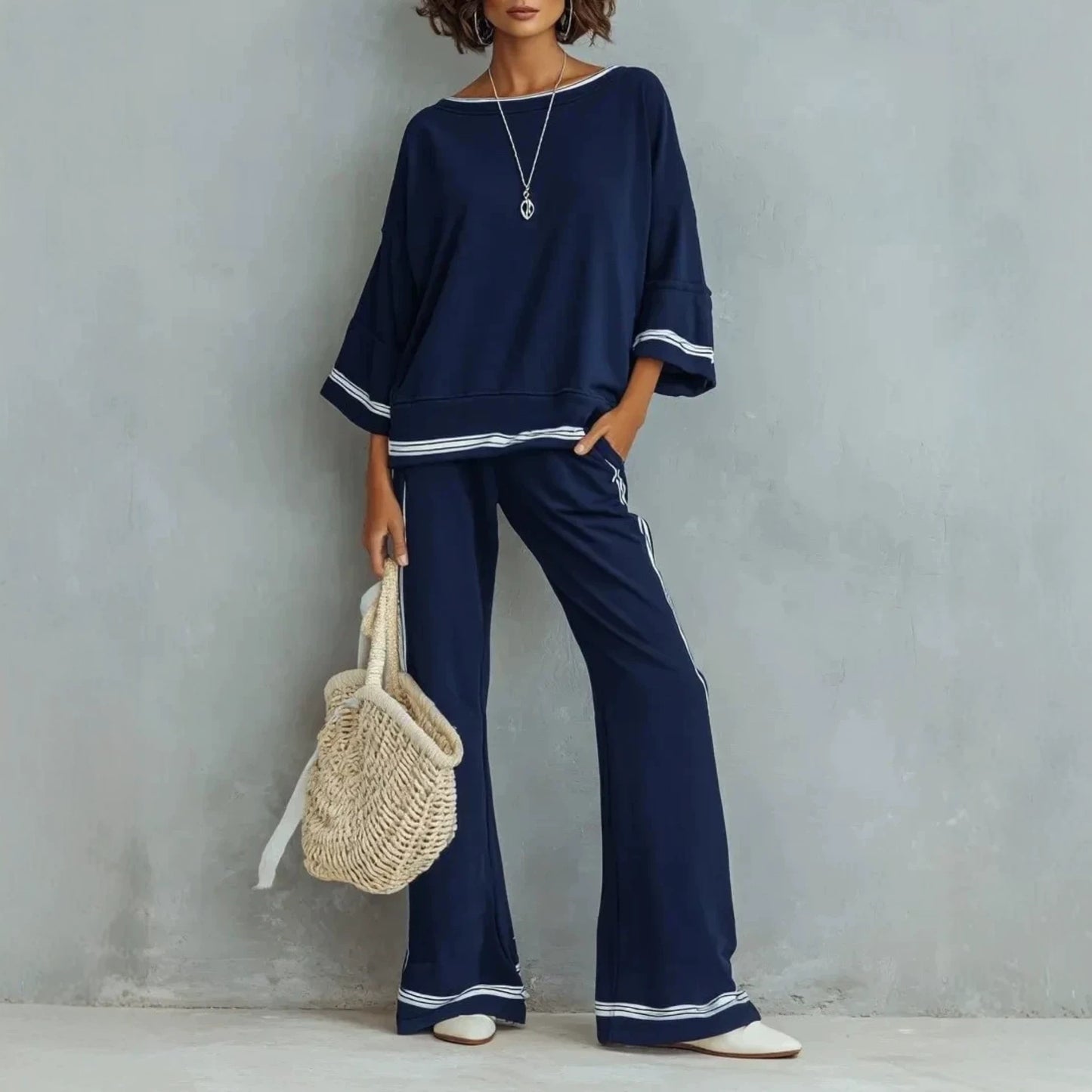 Model walking to show movement in the wide-leg trouser hem