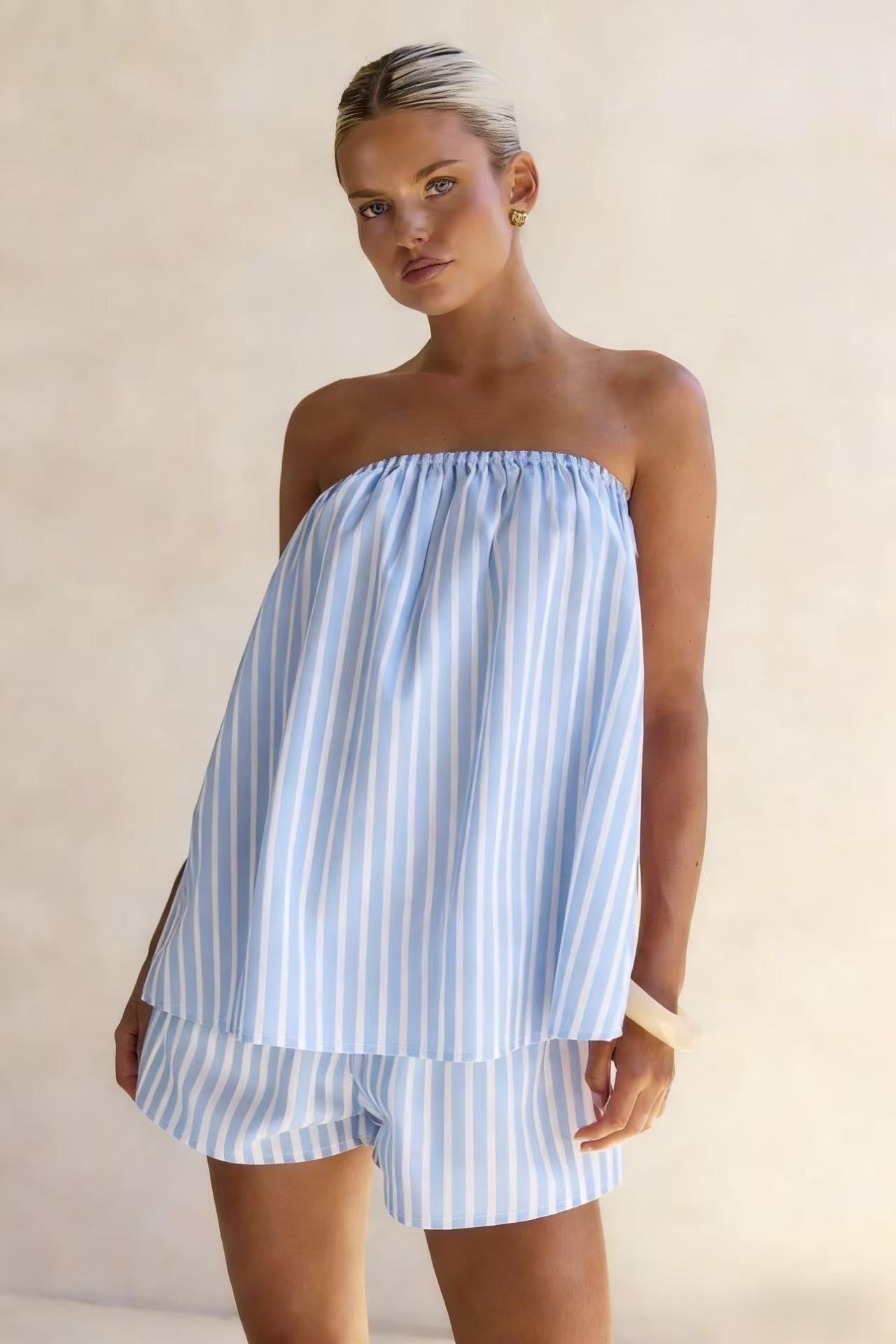 Front view of strapless striped tube top worn with matching high-rise shorts