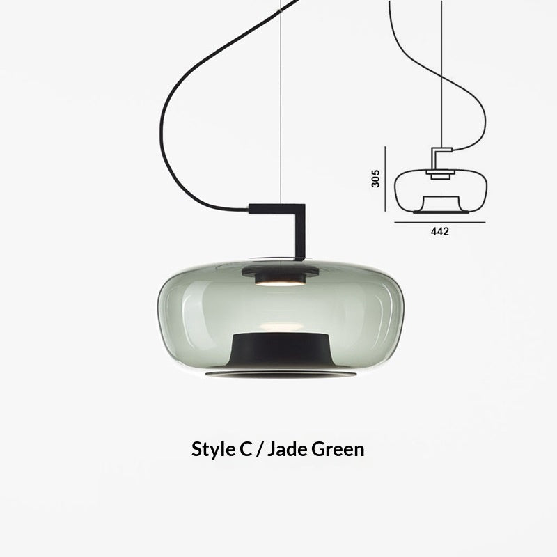 Scale reference shot of the glass pendant shade held against a plain backdrop