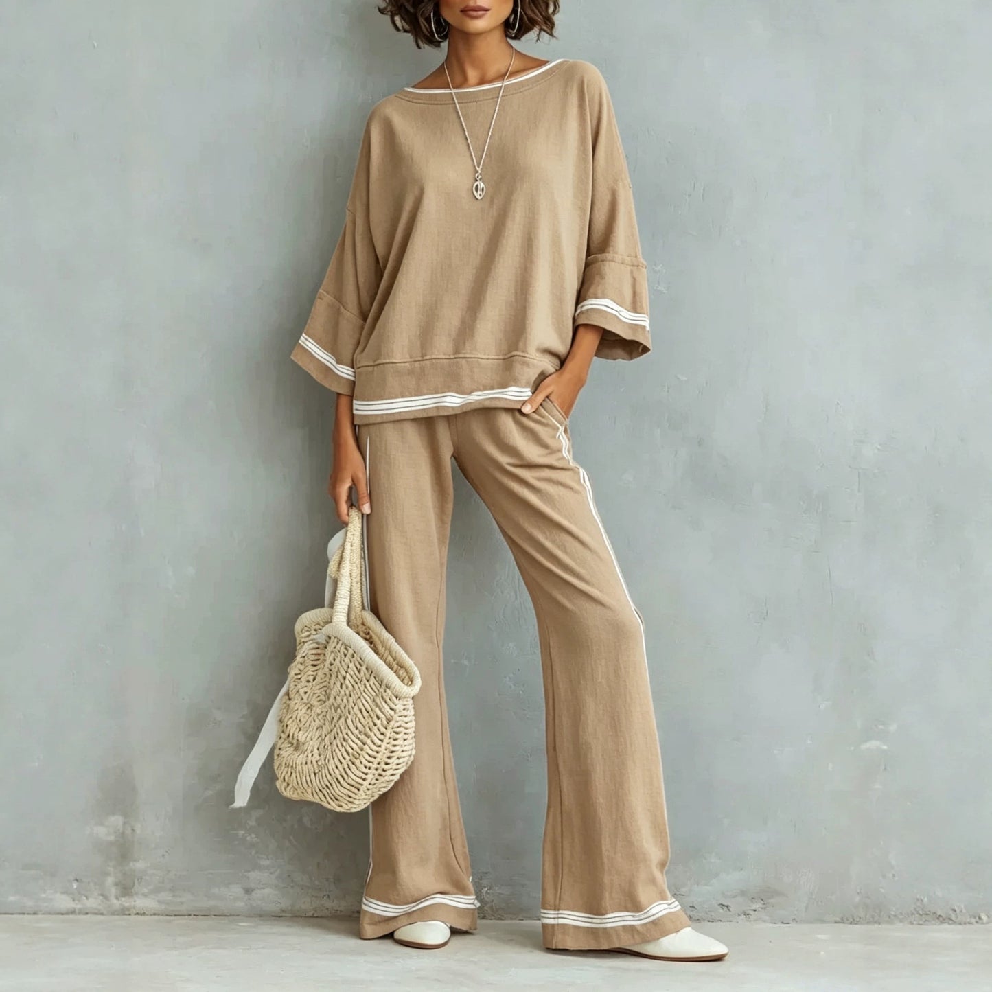 Side profile showing the fluid drape of the wide-leg pants