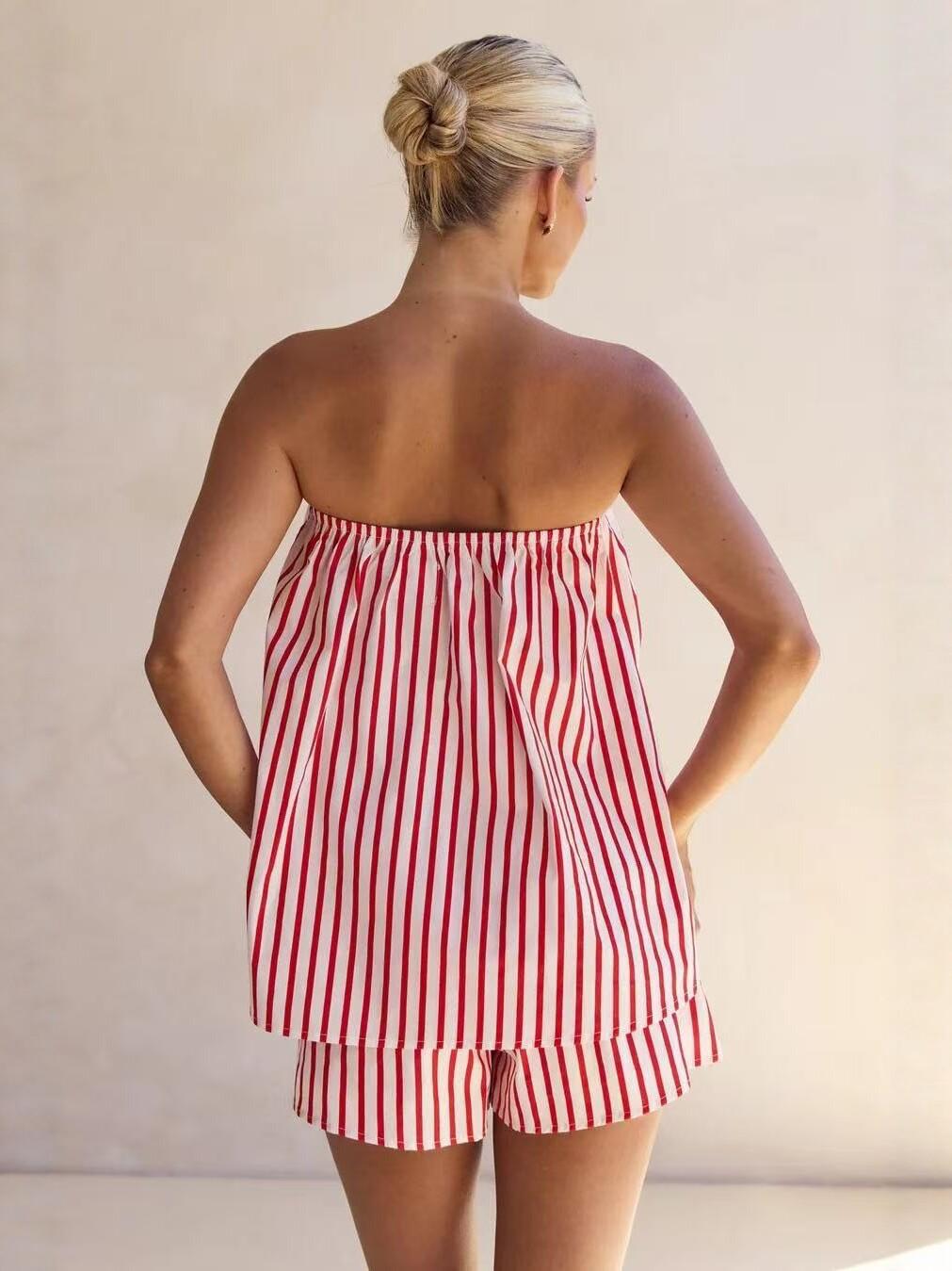 Full-length studio shot of striped tube top and shorts set on soft warm-grey seamless backdrop