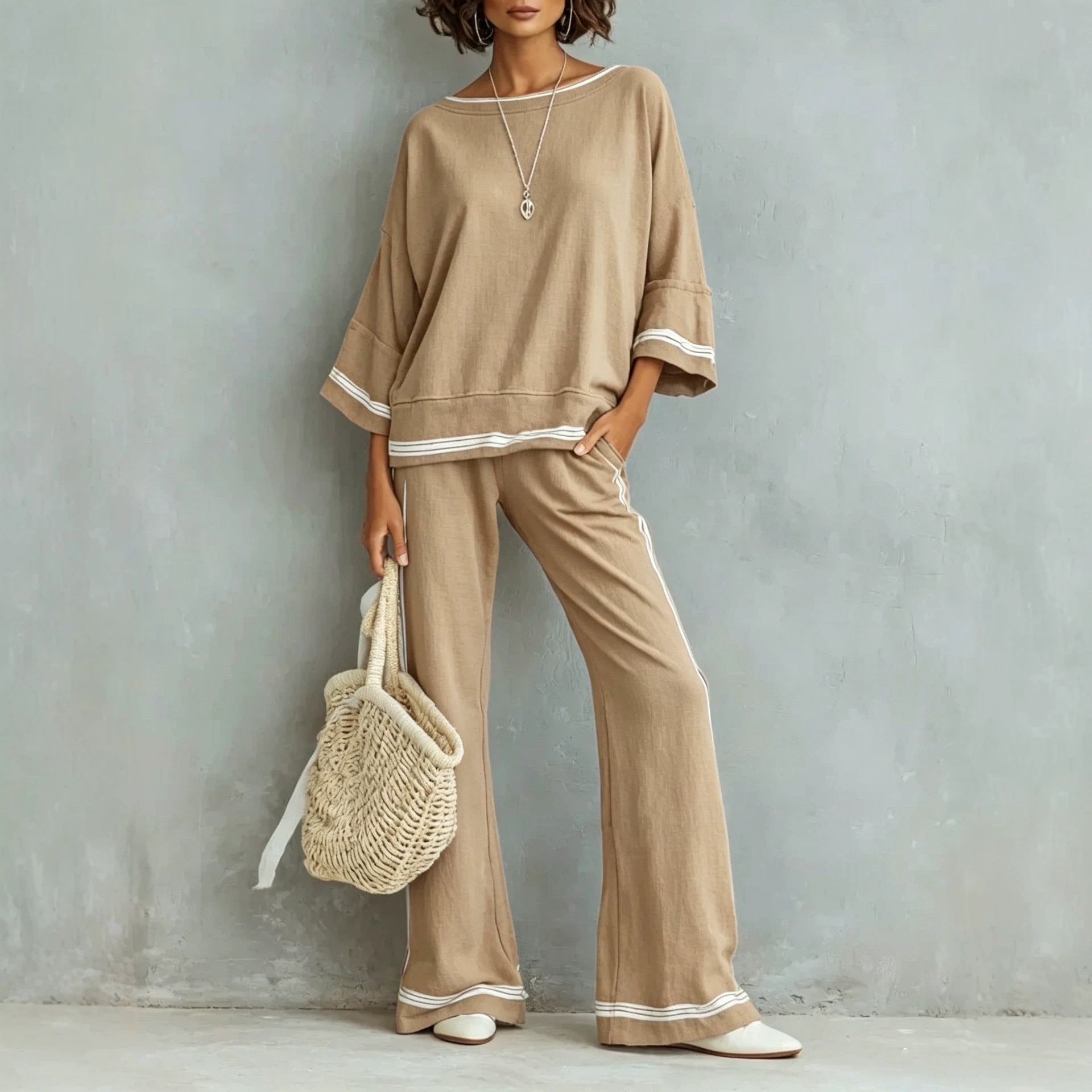 Back view of the two-piece set on warm-grey backdrop